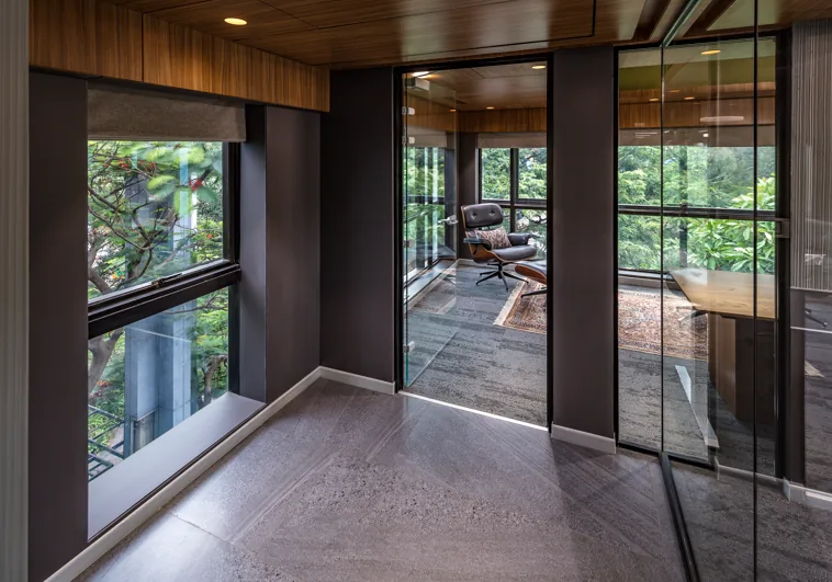 Executive office corridor and glass partitions by Rizin Spaces